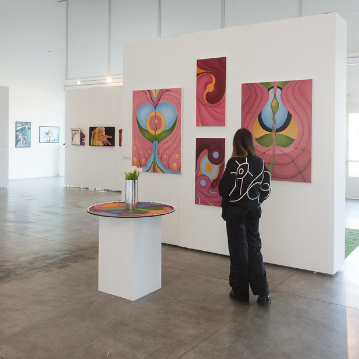 Student observing art in a gallery